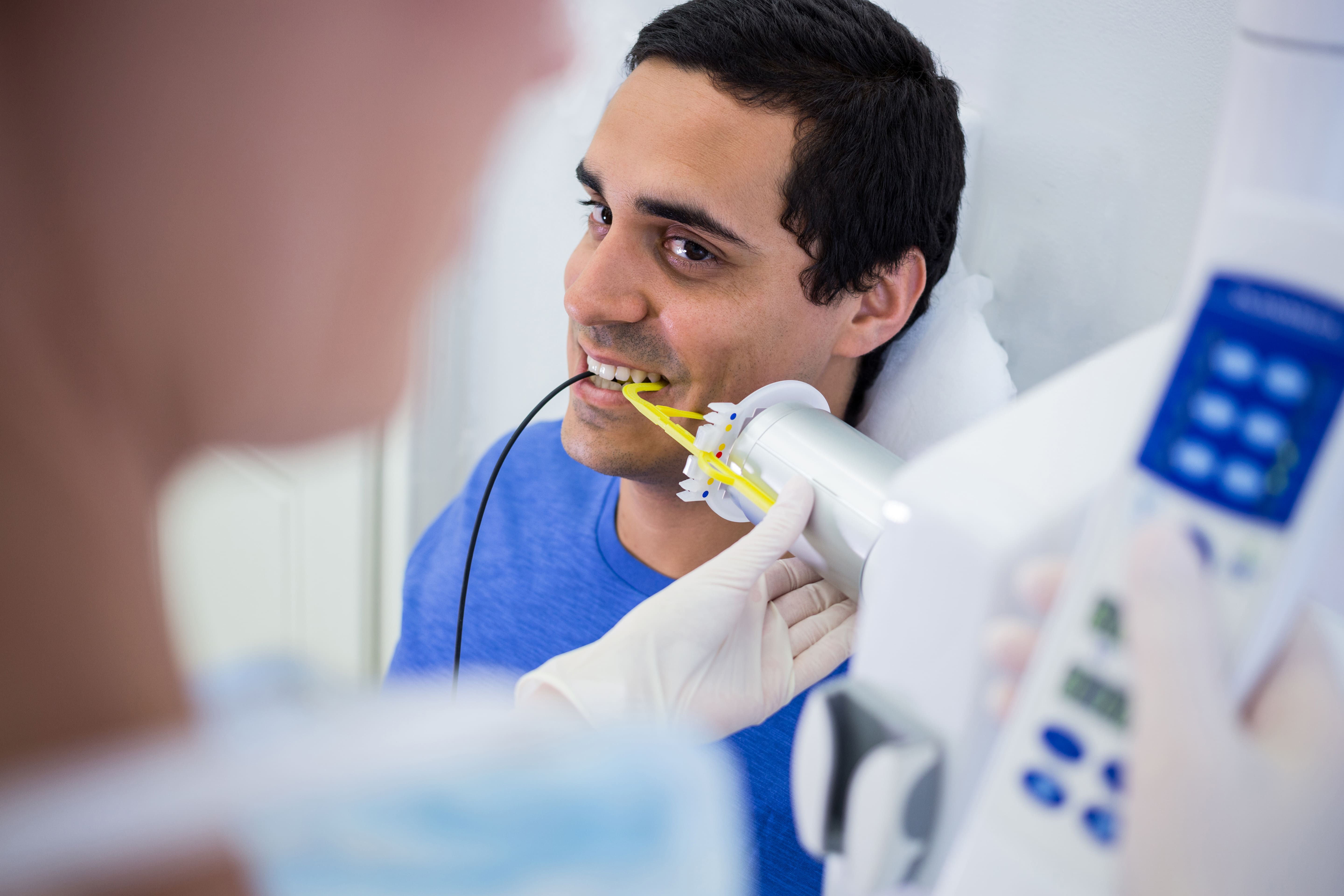 Dental scaling removing tartar around the gum line